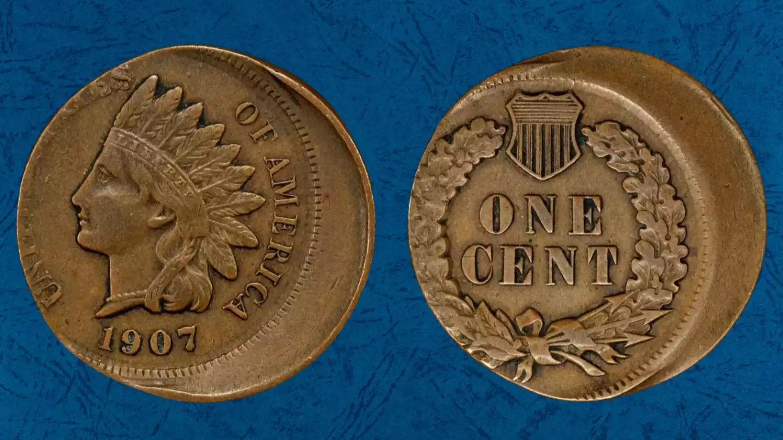 1907 Indian Head penny off-center strike error showing crescent blank area with date still visible